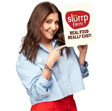 Person holding Slurrp product